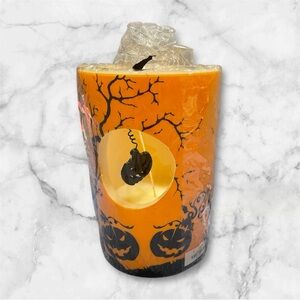Two's Company Orange Candle with Black Pumpkin Design